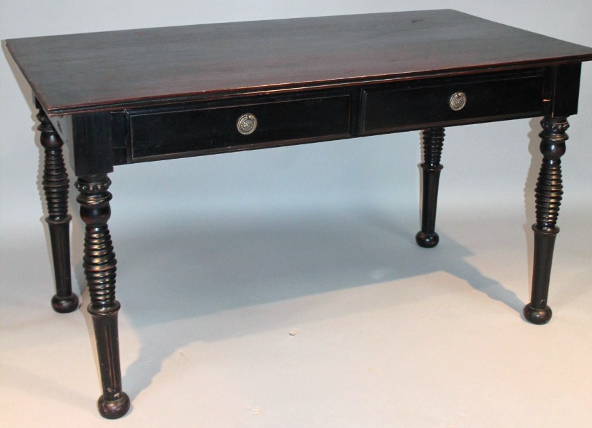 Appraisal: A thC ebonised occasional table with a rectangular overhanging top