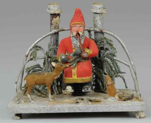 Appraisal: SEATED SANTA SMOKER Germany hand painted composition Santa in red