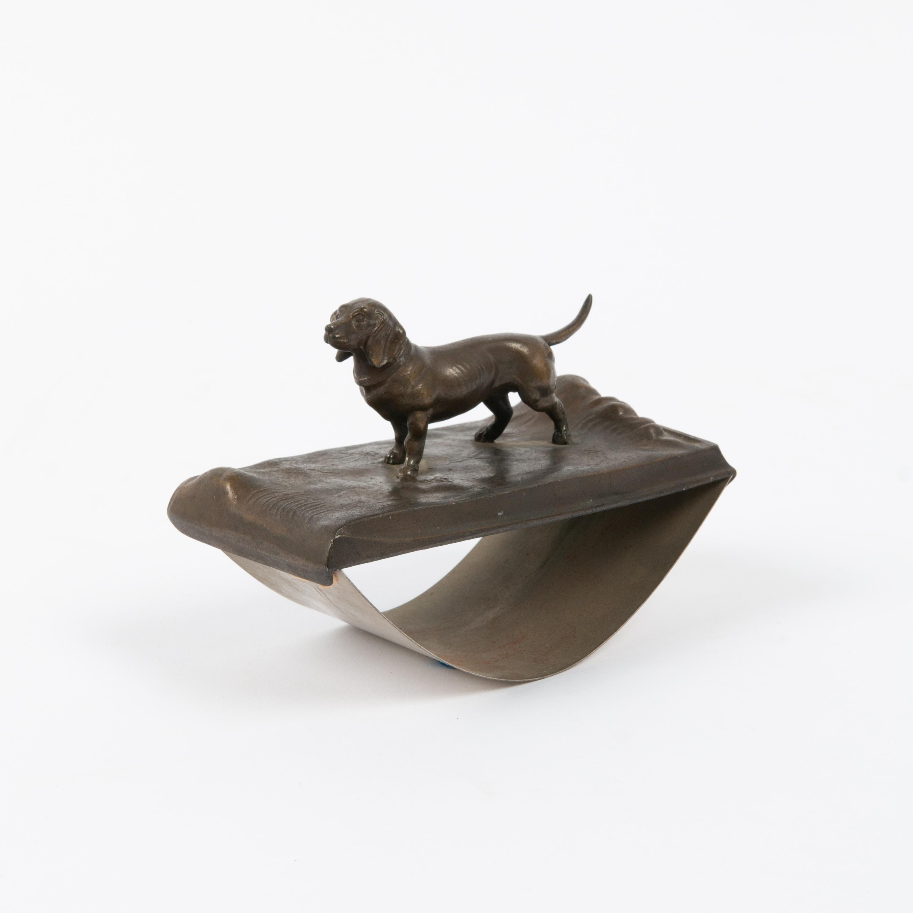 Appraisal: AUSTRIAN BRONZE DACHSHUND INK BLOTTER A sculptural bronze rocking ink