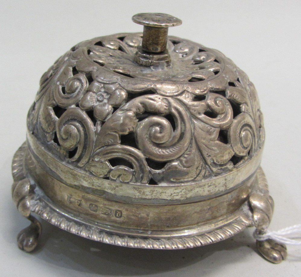 Appraisal: A late Victorian silver mounted circular table bell with floral