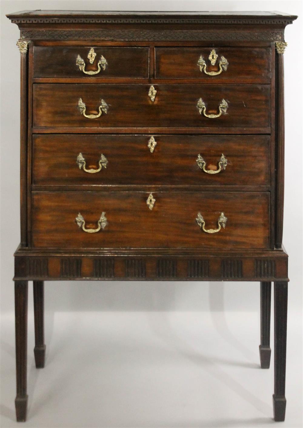 Appraisal: GEORGIAN MAHOGANY CHEST ON STAND having a molded cornice with