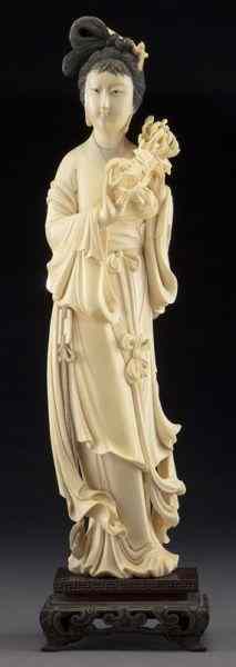 Appraisal: Chinese carved ivory beauty holding flowers International buyers should note