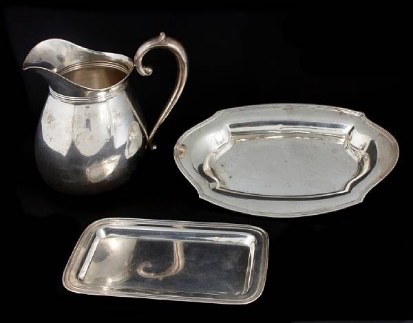 Appraisal: A group of three sterling table articles Comprising pints water