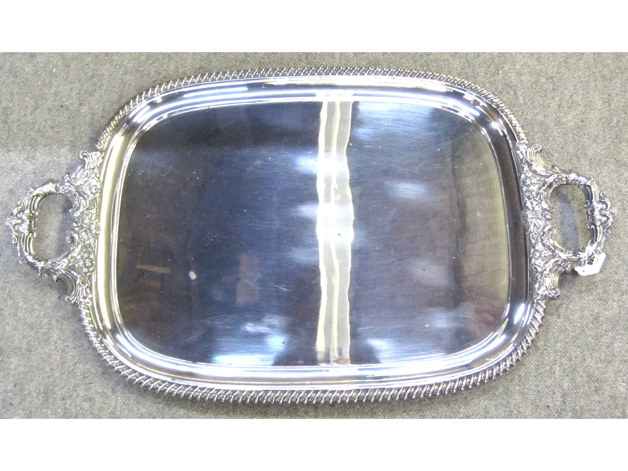 Appraisal: A silver plated double handled serving tray