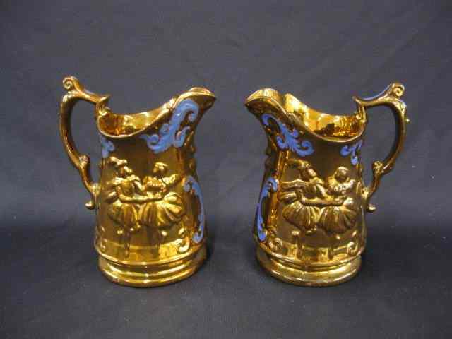 Appraisal: Pair of English Copper Luster Pitchers dancing couple blue trim