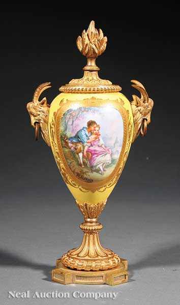 Appraisal: A Sevres Yellow Ground Polychrome and Gilt-Decorated Porcelain Gilt Bronze-Mounted