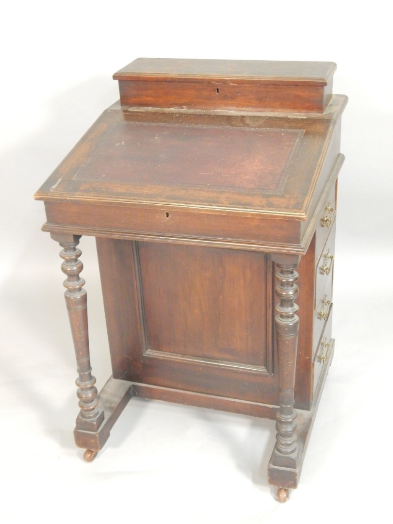 Appraisal: A late Victorian mahogany davenport the top with a raised