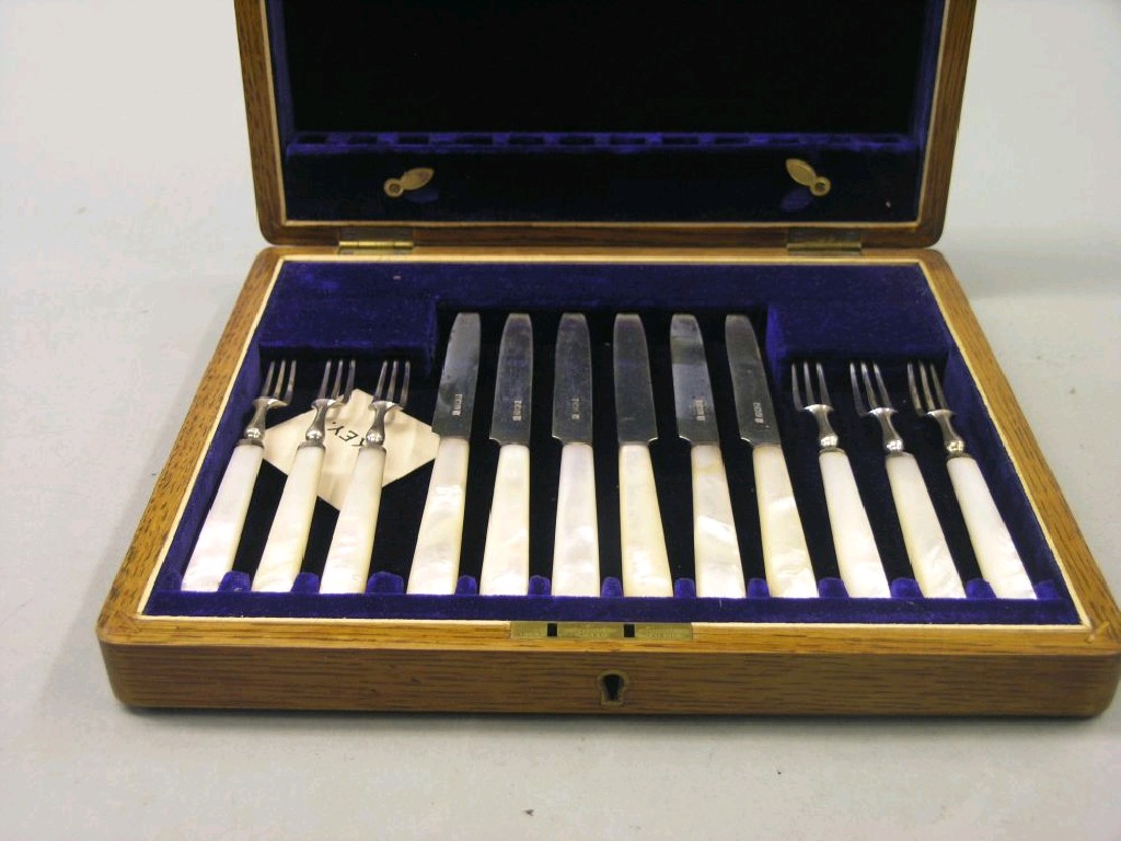 Appraisal: A set of six silver dessert knives and forks with