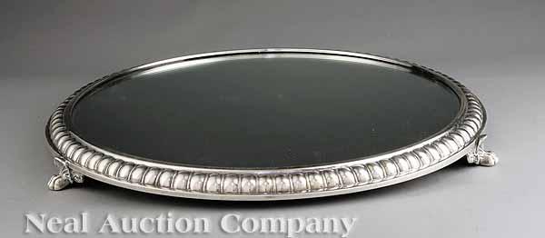 Appraisal: A Pair of Regency-Style Silverplate Plateaux each circular mirror with