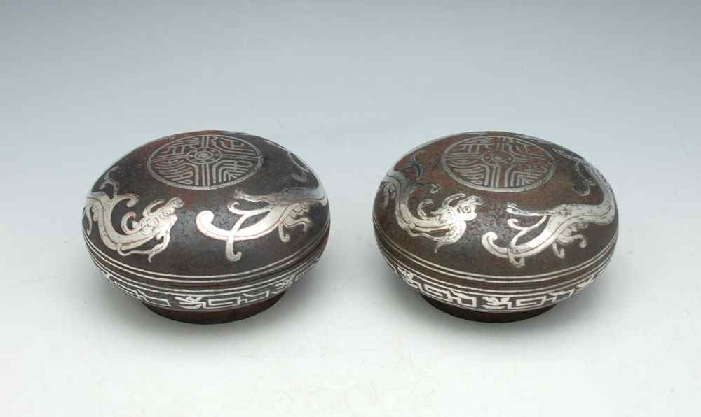 Appraisal: CHINESE SILVER INLAY COVERED BOXES Iron covered boxes with silver