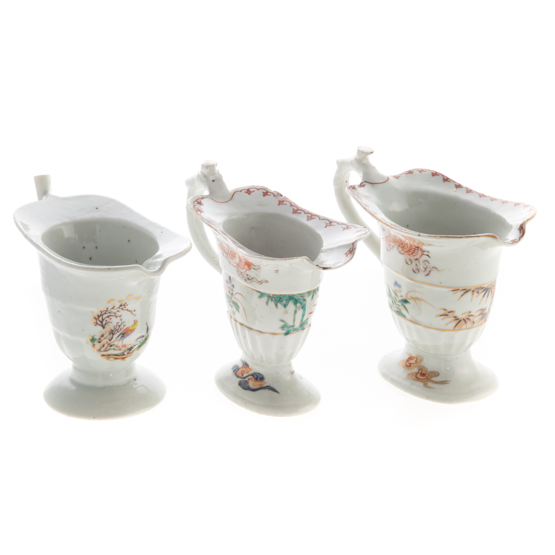 Appraisal: Three Chinese Export porcelain helmet jugs near pair with crane