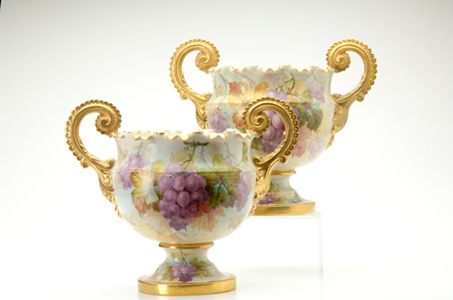 Appraisal: WILLETTS BELLEEK Pair of scalloped urns painted by Walter Marsh