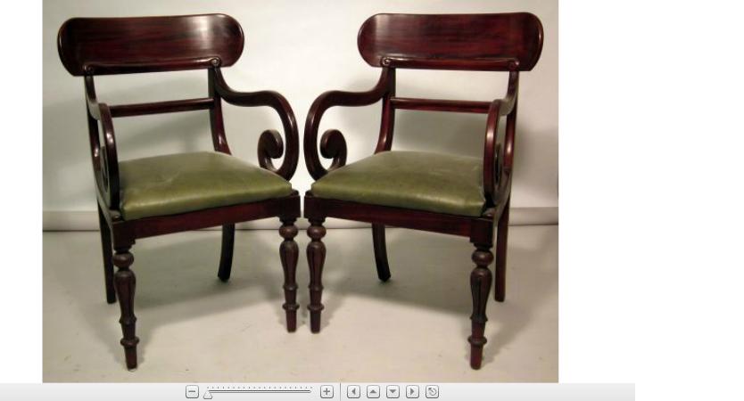 Appraisal: Pair of Regency style mahogany armchairsThe plain oval back supported