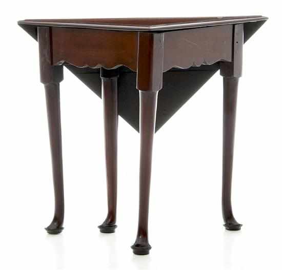 Appraisal: Georgian style mahogany handkerchief table early th century triangular molded