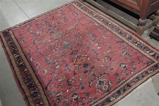 Appraisal: ORIENTAL AREA RUG Dark salmon ground with triple border anf