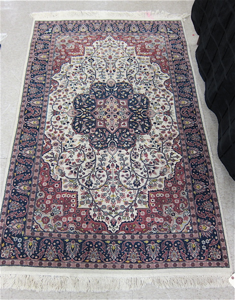 Appraisal: HAND KNOTTED ORIENTAL AREA RUG Pakistani-Persian floral and central floral