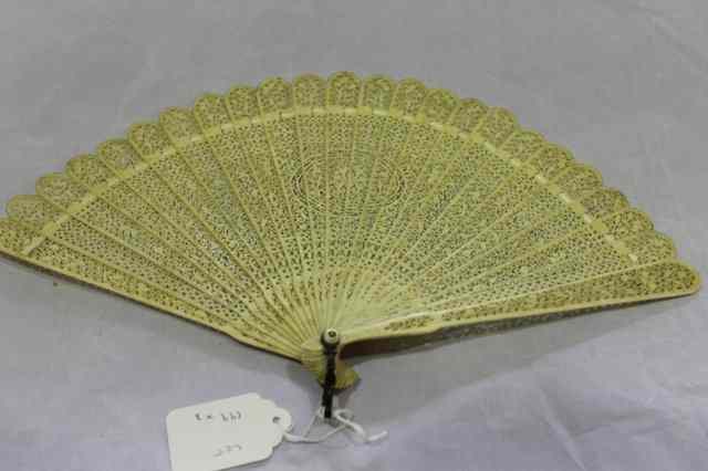 Appraisal: A COLLECTION OF THREE CHINESE CANTON CARVED IVORY SMALL FANS