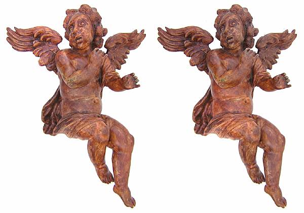 Appraisal: A pair of carved wood angels height in width in