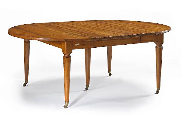 Appraisal: A Louis XVI style walnut dining table The circular top