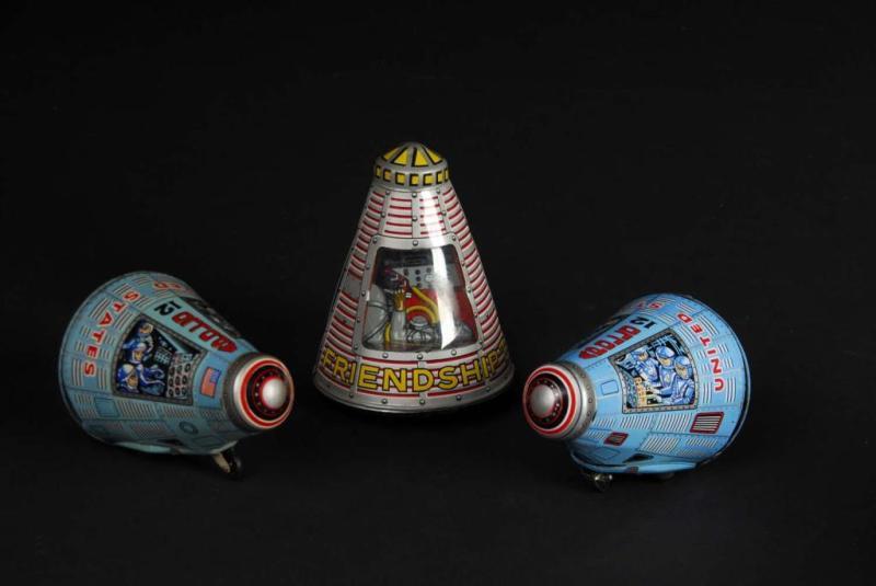 Appraisal: Lot of Tin Space Capsule Friction Toys Description Japanese All