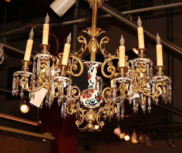 Appraisal: A gilt bronze porcelain and glass mounted twelve light chandelier