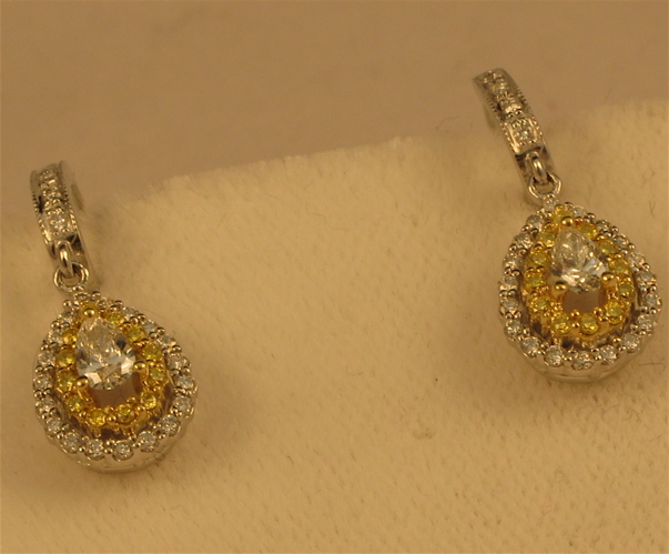 Appraisal: PAIR OF DIAMOND AND FOURTEEN KARAT YELLOW AND WHITE GOLD