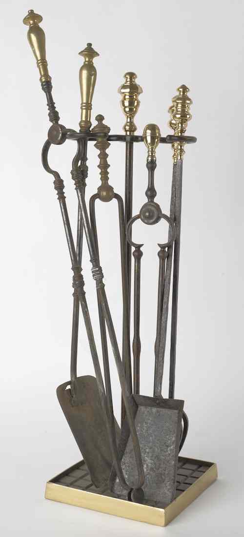 Appraisal: Group of brass and iron fireplace tools Provenance the Collection