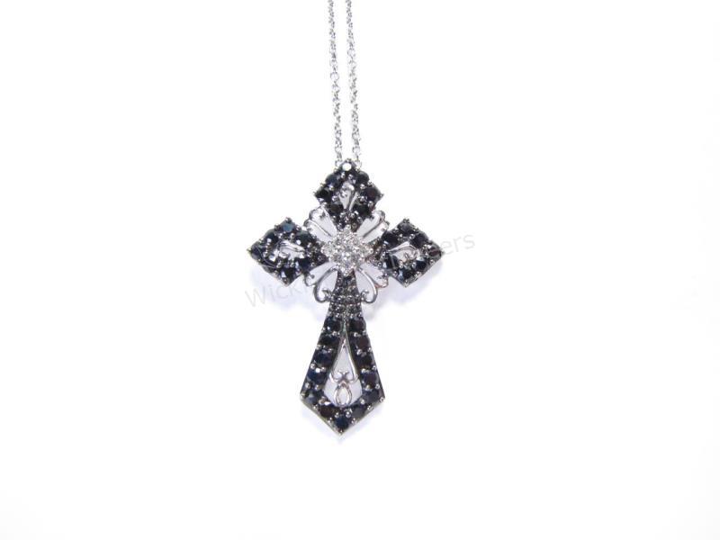 Appraisal: A K white and black diamond cross pendant on a