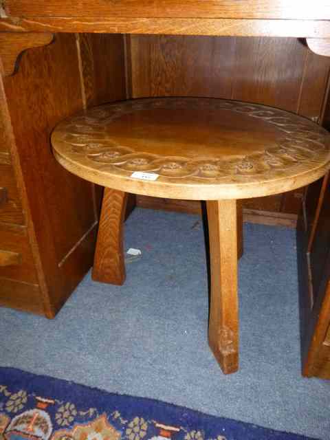 Appraisal: A CARVED OAK CIRCULAR GNOME MAN OCCASIONAL TABLE with carved