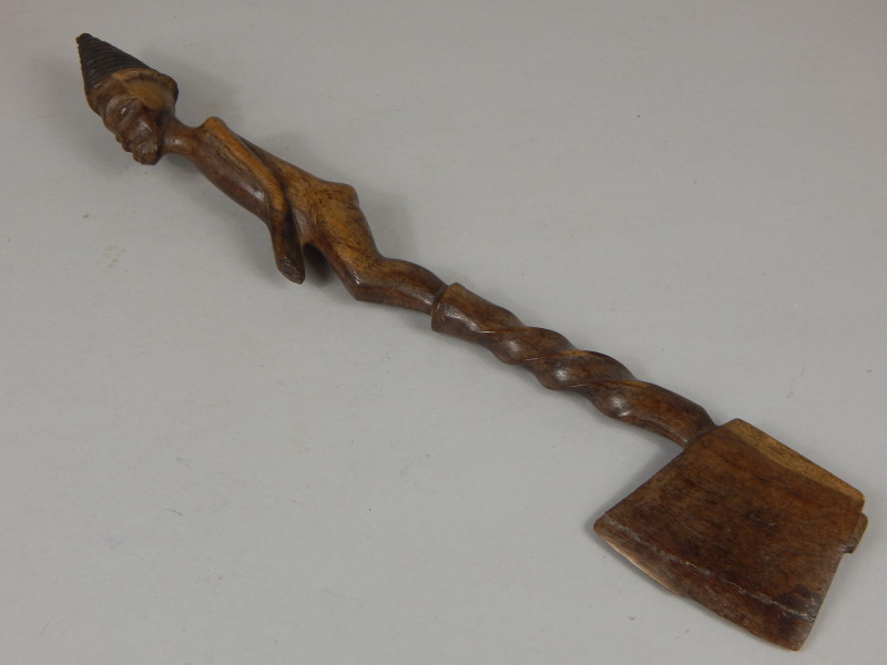 Appraisal: Tribal Art A carved hardwood axe with a figural handle