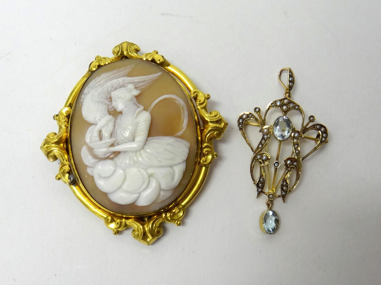 Appraisal: A gold seed pearl and pale blue gem set pendant