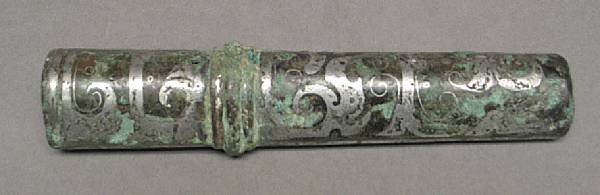 Appraisal: A silver-inlaid bronze fitting Han Dynasty Of compressed oval section