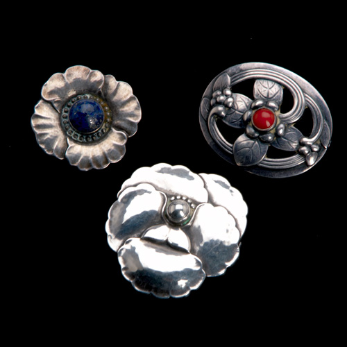 Appraisal: Three Georg Jensen brooches in sterling with red coral cabochon