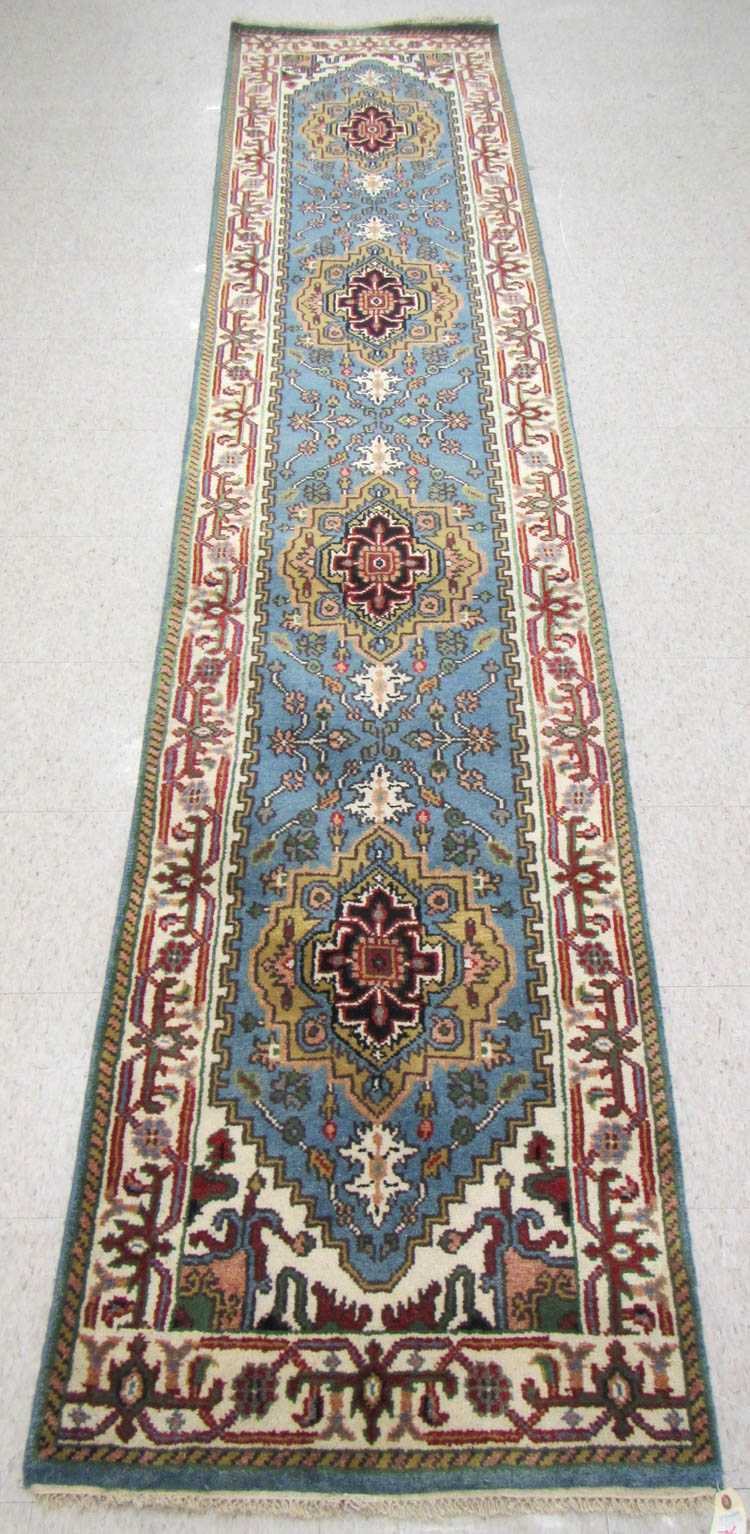 Appraisal: HAND KNOTTED ORIENTAL RUNNER Indo-Persian four geometric medallions and stylized