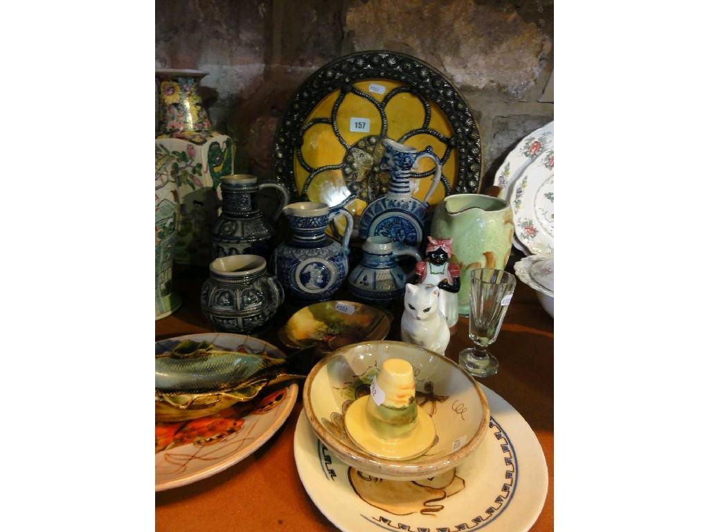 Appraisal: A collection of ceramics including German stoneware ewers and jugs