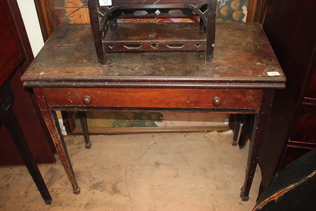 Appraisal: A GEORGE III MAHOGANY FOLD-OVER LIBRARY TABLE with leather inset