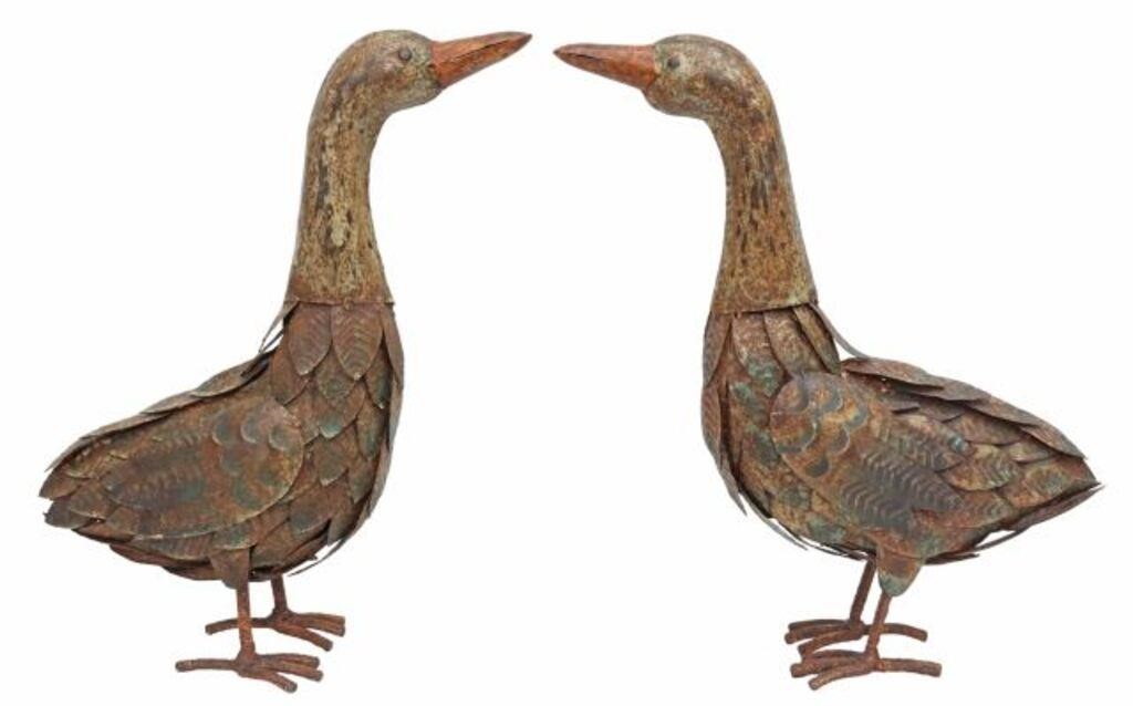 Appraisal: pair Primitive sheet metal duck sculptures th c with rebar