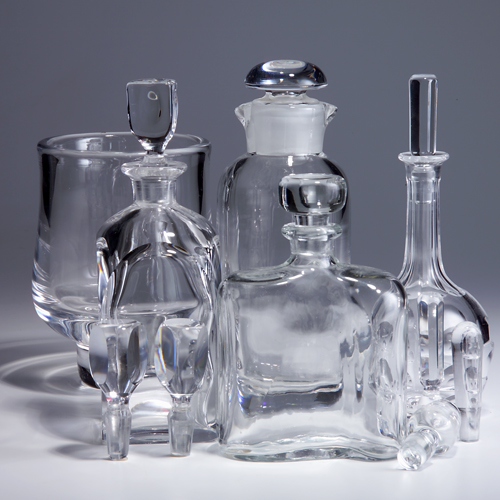 Appraisal: Four Orrefors decanters with stoppers together with a vase and