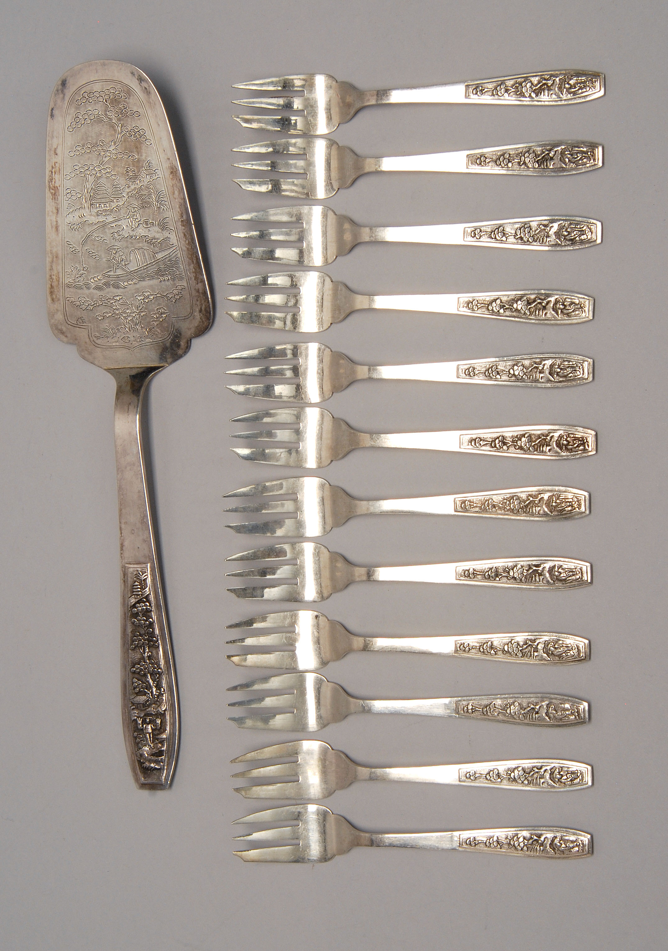 Appraisal: VIETNAMESE FINE SILVER DESSERT SET including twelve forks and a