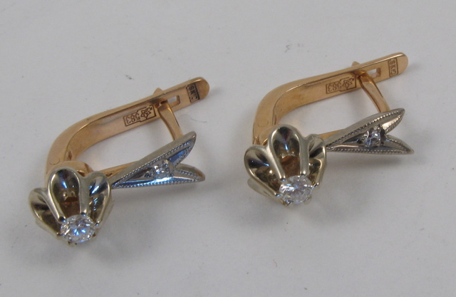 Appraisal: PAIR OF DIAMOND EARRINGS each yellow and white gold and