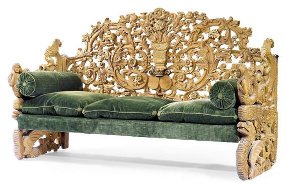 Appraisal: CARVED SOFA Colonial probably India Carved softwood Green velvet cushions