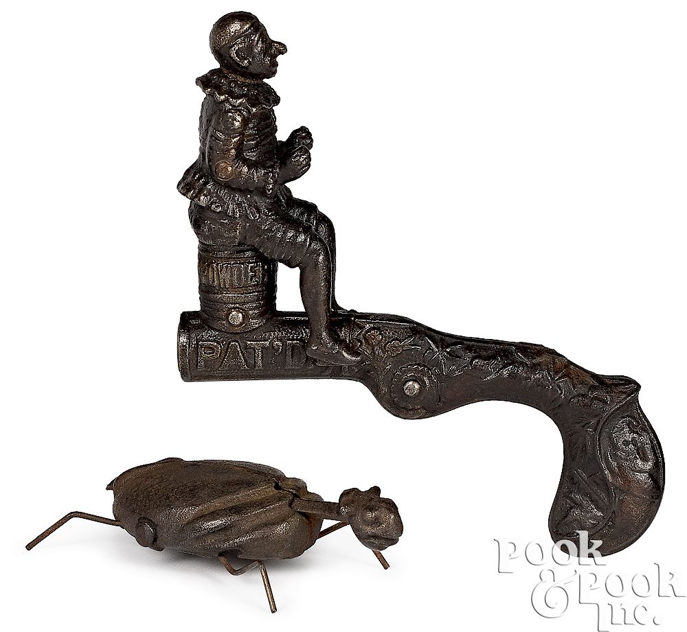 Appraisal: Two cast iron animated cap guns Cast iron animated cap