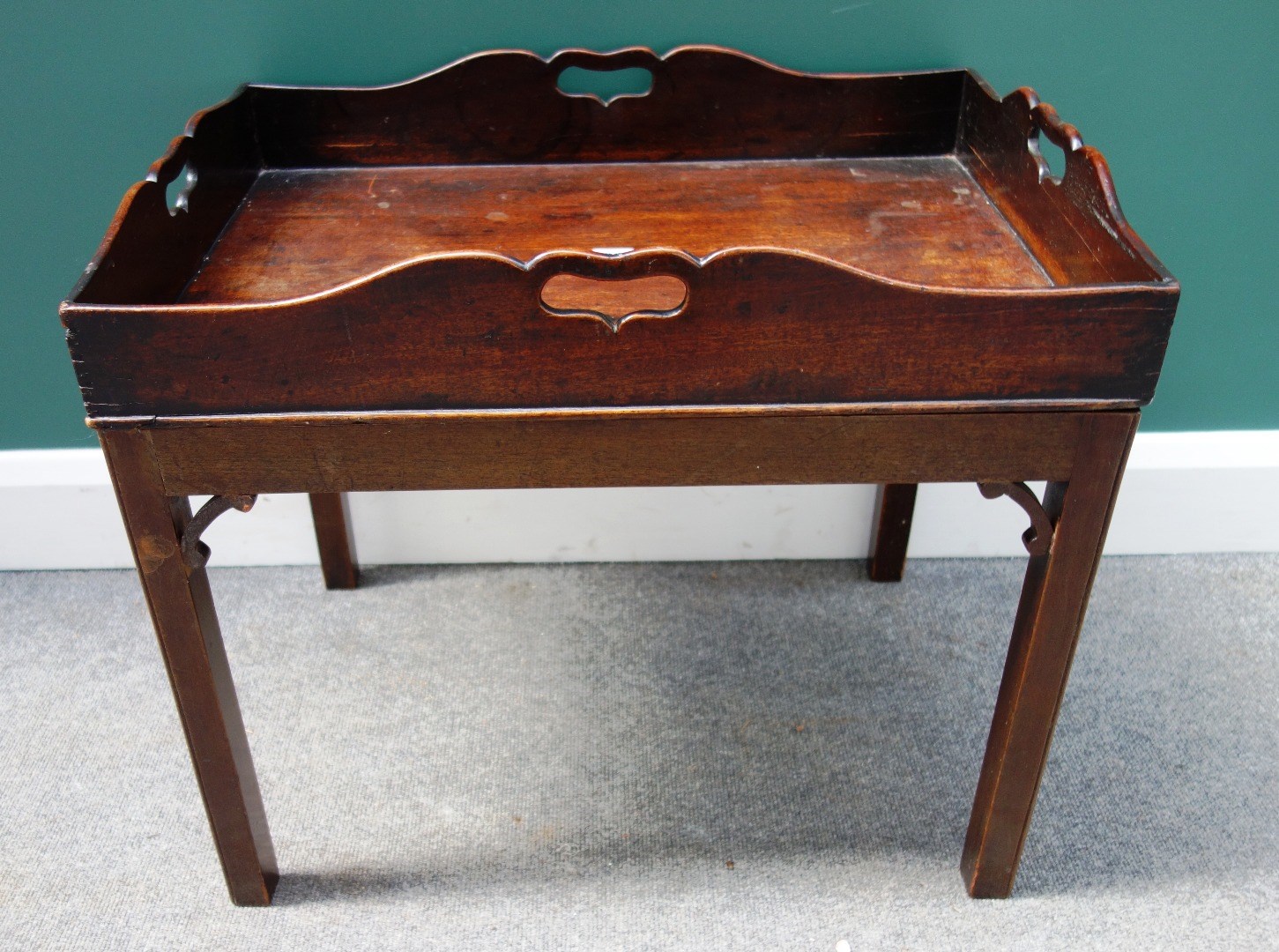 Appraisal: A George III mahogany rectangular butler's tray with pierced sides