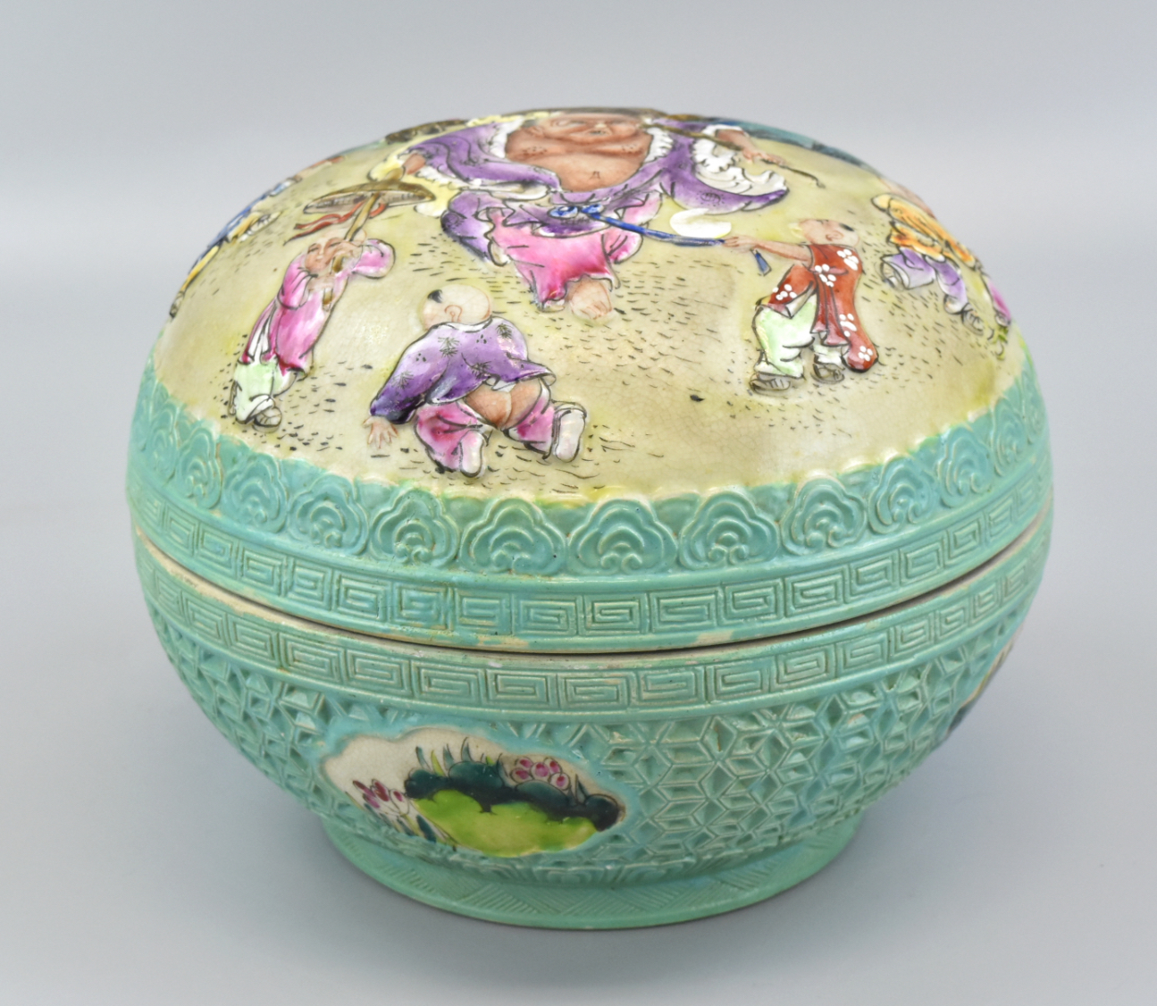 Appraisal: A Chinese dome shaped famille rose covered box with central