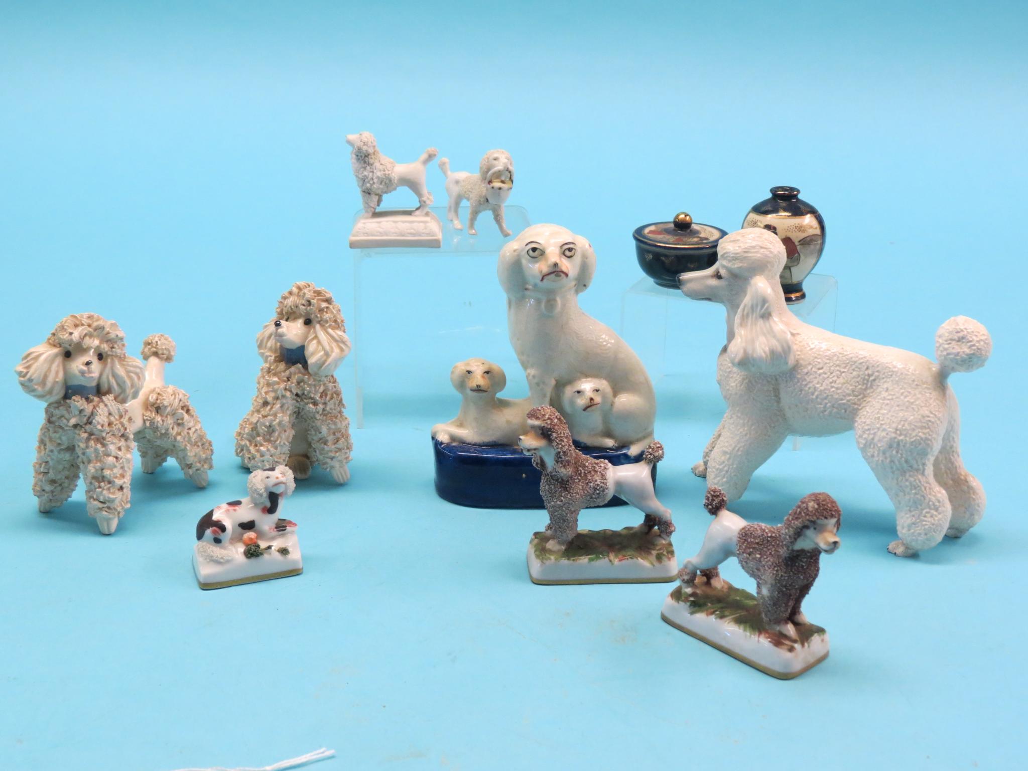 Appraisal: A pair of continental porcelain poodle models seven other ceramic