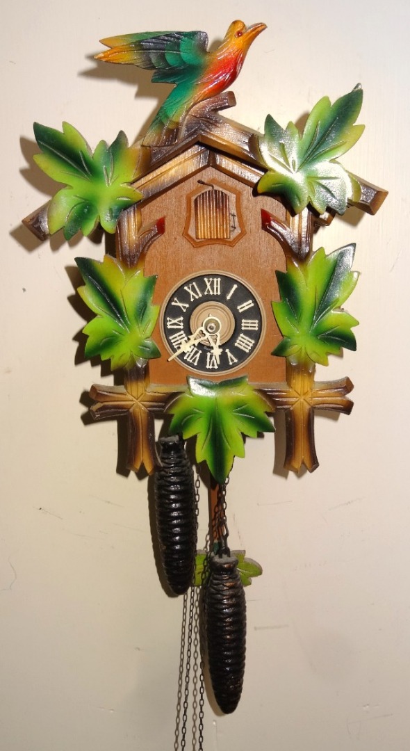 Appraisal: A modern Black Forest style cuckoo clock with bird and