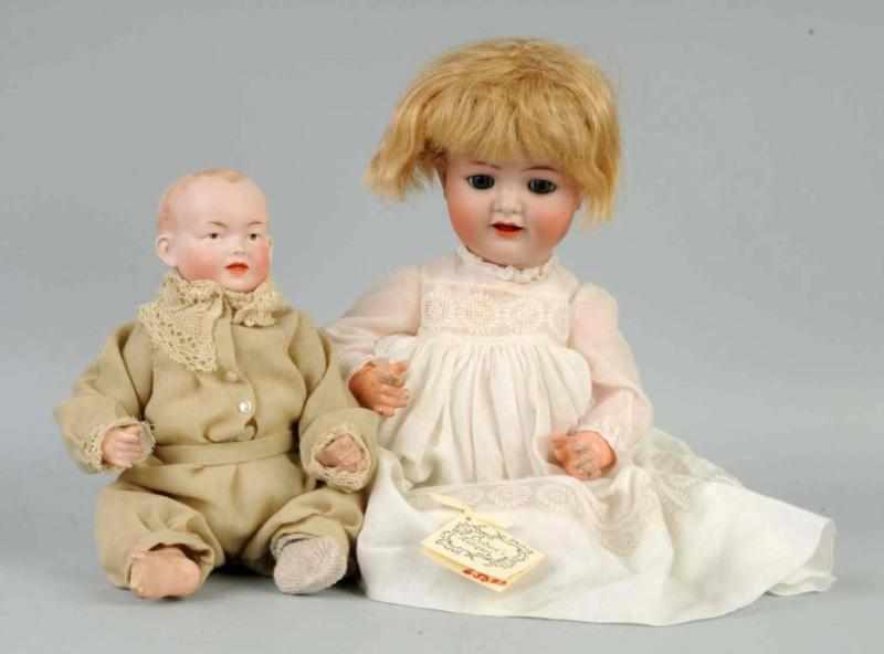 Appraisal: Lot of German Bisque Character Baby Dolls Description One incised