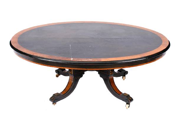 Appraisal: An English Aesthetic tilt top table retains stamp John Taylor