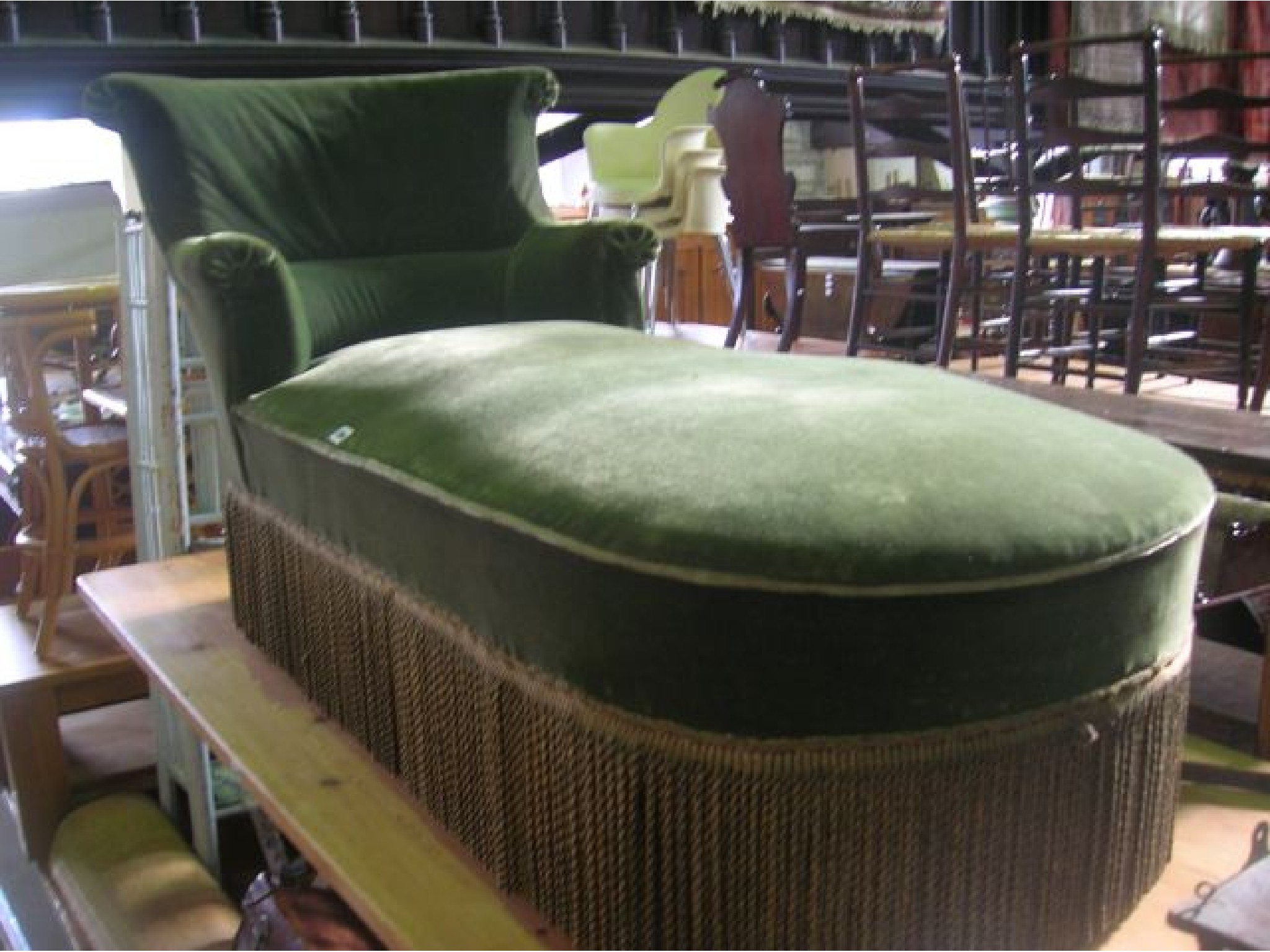 Appraisal: An early th century day bed with upholstered seat and