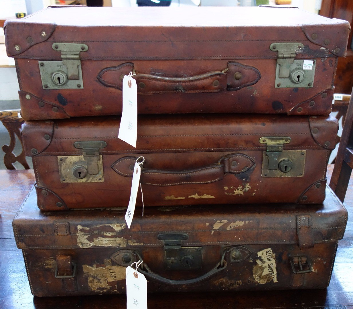 Appraisal: A heavy leather vintage suitcase with gilt metal hardware stamped